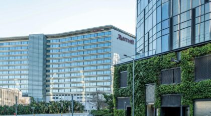 View of urban architecture with green facade in modern Hong Kong.