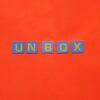 Bright letters spelling 'unbox' on a vivid red background, minimalist design.