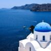 Experience the breathtaking beauty of Santorini's iconic blue-domed churches overlooking the Aegean Sea.