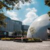 Photo of Hong Kong Space Museum dome and Hong Kong Museum of Art under a sunny sky.