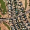 Discover the luxury homes and green golf courses in Sheikh Zayed, Egypt, captured from above.