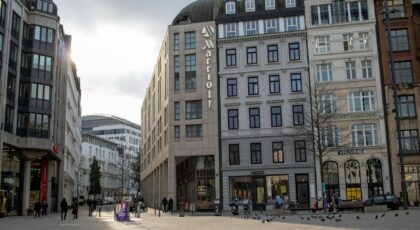 A bustling afternoon scene at Gänsemarkt square in downtown Hamburg with iconic architecture.