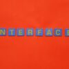 Blue blocks with yellow letters spelling 'INTERFACE' stand out against a vibrant orange backdrop.