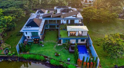 Stunning aerial view of a luxury villa by the river in Tangerang, Indonesia.