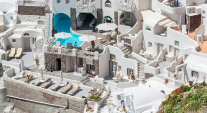 Explore the stunning white-washed buildings of Santorini with this captivating aerial view.